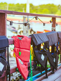 Rear view of clothes hanging on railing in city