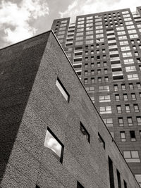 Low angle view of office building against sky