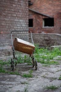 Old antique baby carriage on a farm