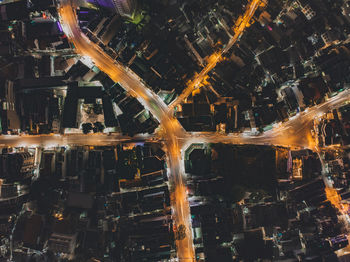 High angle view of illuminated city buildings at night