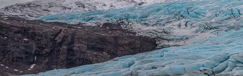 Glacier meets mountain rock