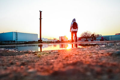 Man against clear sky during sunset