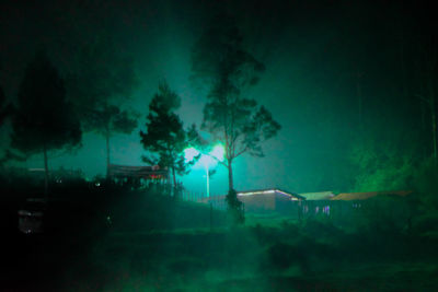 View of illuminated street at night