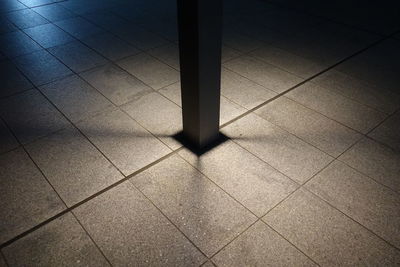 High angle view of illuminated tiled floor