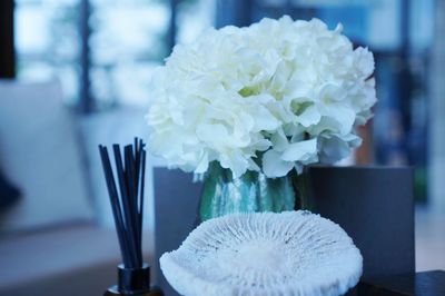 Close-up of white flower vase on table