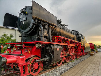 Train on railroad tracks against sky