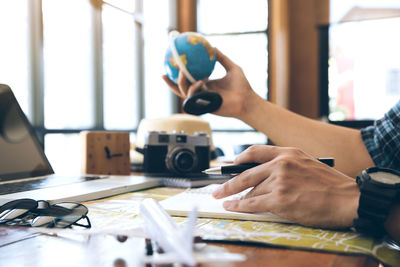 Close-up of man working on table