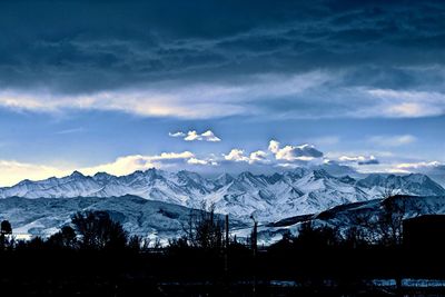 Scenic view of snowcapped mountains against sky