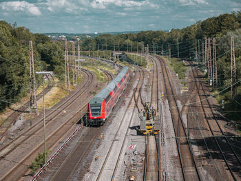 High angle view of train on railroad tracks against sky