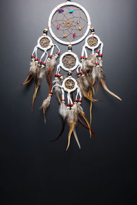 Dreamcatcher hanging against black background