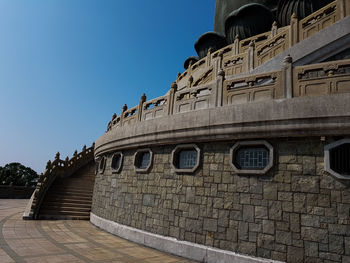 Low angle view of building against blue sky