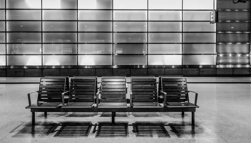 Empty chairs on train station