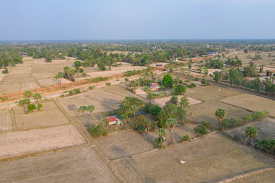 High angle view of trees and buildings against sky