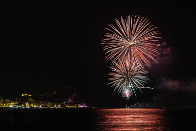 Firework display at night