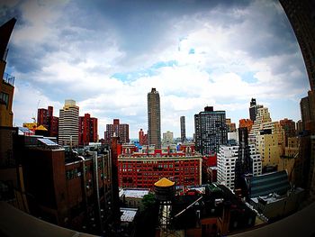 Buildings in city against sky