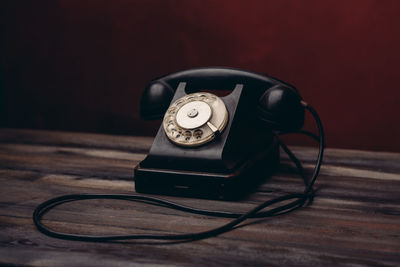 Close-up of telephone on table