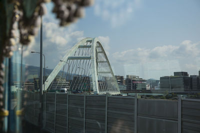Modern buildings in city against sky
