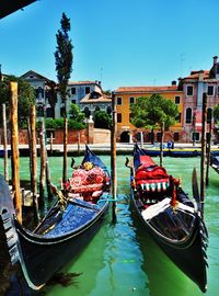 Boats moored in canal