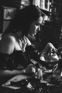 Rear view of woman sitting at restaurant