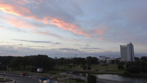 View of road against cloudy sky at sunset