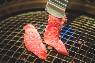 Close-up of meat on barbecue grill