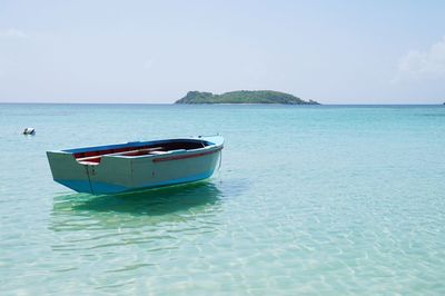 Boat in sea against sky