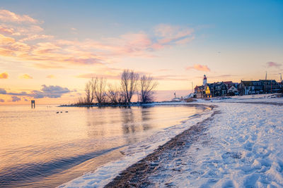 Scenic view of frozen sea against sky during sunset