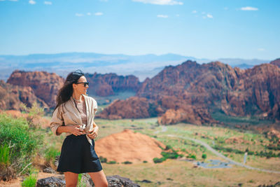 Side view of man standing on mountain