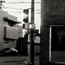 Text on road against buildings in city