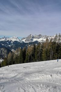 Scenic view of snowcapped mountains against sky