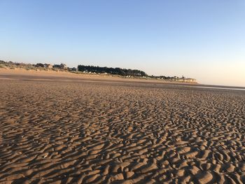 Scenic view of desert against clear sky