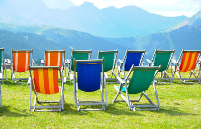 Empty chairs in park