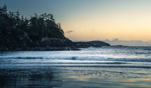 Scenic view of sea against clear sky during sunset