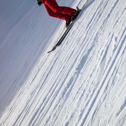 Tilt image of ski lift against snowcapped mountain
