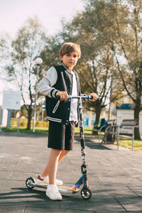 Full length of boy standing on street