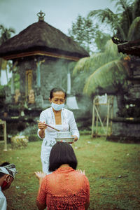 People on field against trees