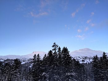 Scenic view of mountains against cloudy sky