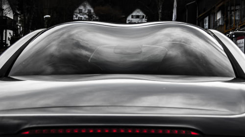 Close-up of car on road