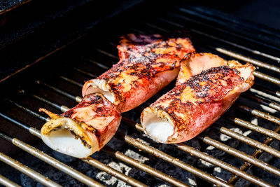 High angle view of meat on barbecue grill