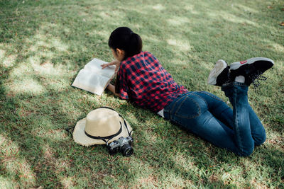 High angle view of man sitting on field