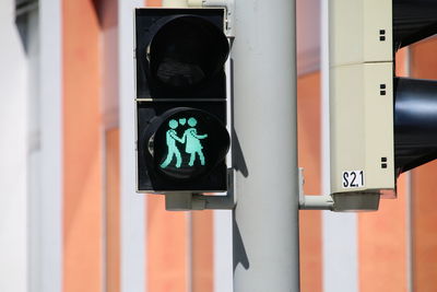 Close-up of road sign traffic light