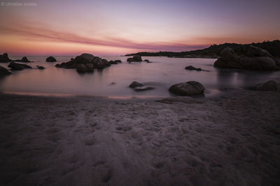 Scenic view of sea at sunset