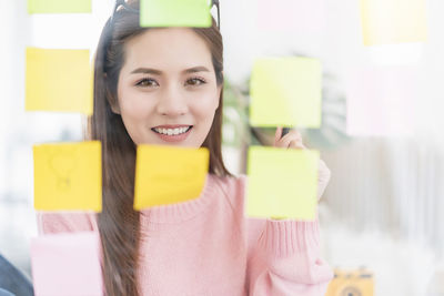 Portrait of a smiling woman working