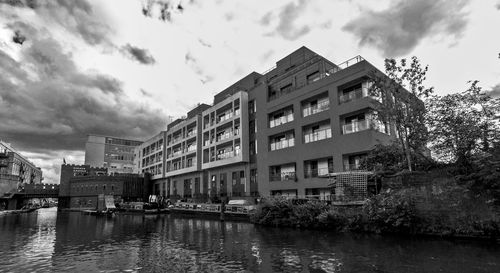 Buildings against cloudy sky
