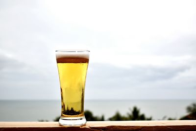 Close-up of beer glass on table