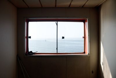 View of sea through window