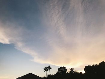 Low angle view of silhouette trees against sky during sunset