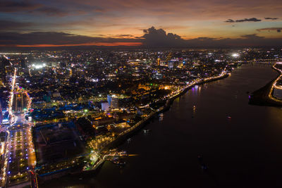 High angle view of illuminated buildings in city at night