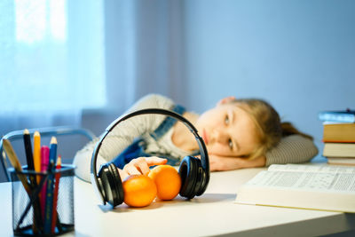 Girl lying on table