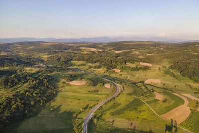 Aerial view of agricultural landscape against sky